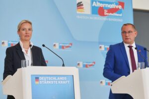 Alice Weidel und Tino Chrupalla bei einer politischen Veranstaltung, umstrittene Äußerungen im Fokus.
