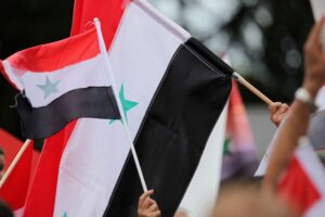 Flagge von Syrien, symbolisierend die aktuellen Abschiebungen nach Syrien und Afghanistan.