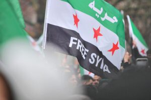 Syrische Flüchtlinge in Deutschland feiern den Sturz von Bashar al-Assad in Syrien.